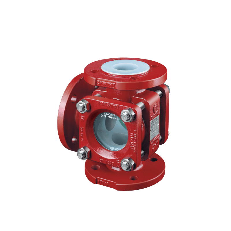 A red and white valve sitting on top of a green background.